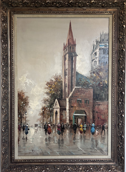 A large canvas painting by artist Antonio De Vity depicting a Paris street view, framed in an ornate gild frame.