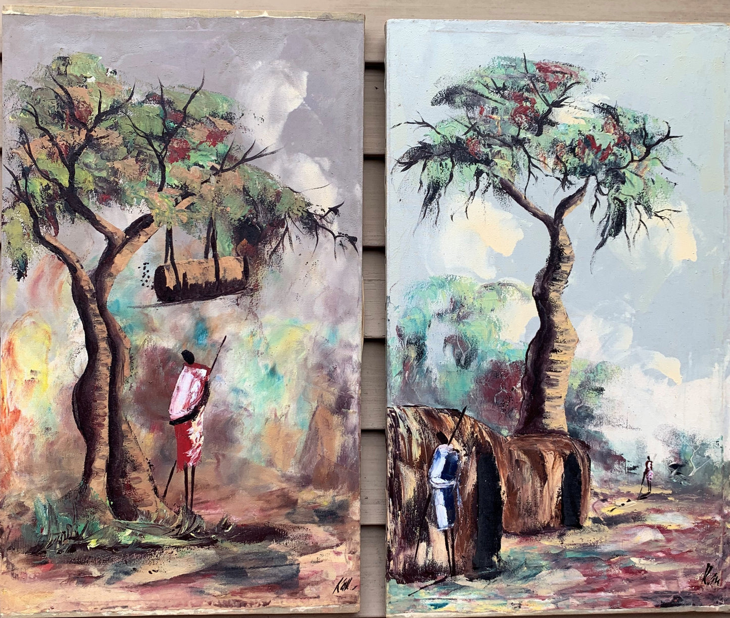 Pair of Vintage African oil on canvas paintings, Villages with figures, Signed